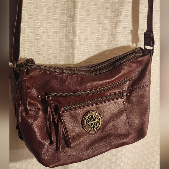 Stone & Co. Handbags - Burgundy Crossbody Bag Gold Logo Adjustable Strap Great For Travel Many Pockets